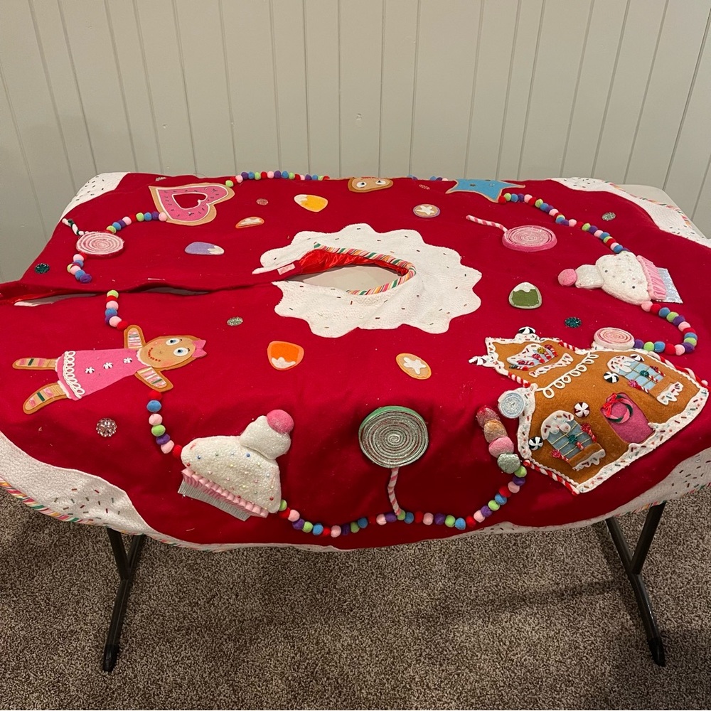 Department 56 tree skirt. Gingerbread and candy themed.